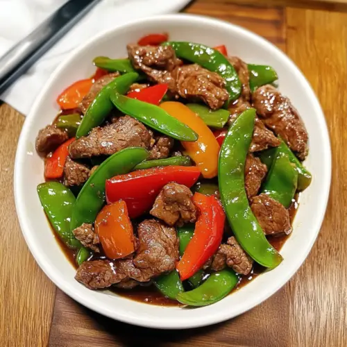 Rindfleisch mit Schneerbsen und Paprika Pfannengericht